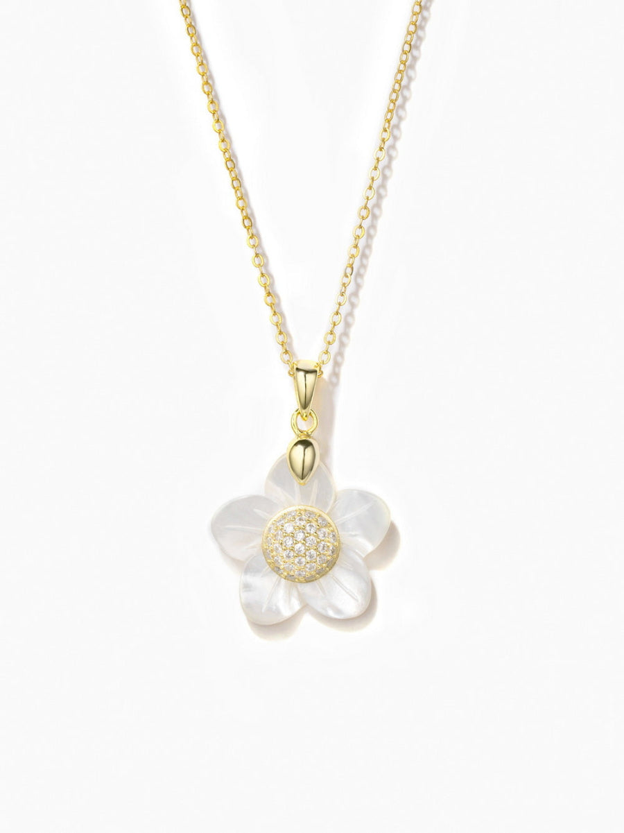 The necklace from Joy & Rachel is crafted from 14K gold plated over 925 sterling silver, featuring a delicate flower design. It is adorned with a 5A cubic zirconia stone and white mother of pearl for a sophisticated touch. The chain measures 16 inches, adjustable to 16", 17", and 18" (44 cm), and the pendant itself measures 0.8 inches. The necklace is finished with a secure lobster clasp.