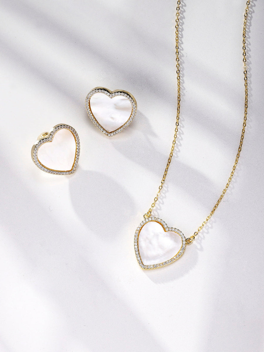 This beautiful jewelry set features matching heart-shaped necklaces and earrings, crafted from 14K gold-plated 925 sterling silver. Adorned with 5A cubic zirconia and white mother of pearl, the set offers a romantic and elegant design. The necklace includes an adjustable chain measuring 16?â‚?18 inches (44 cm) with a lobster lock clasp for secure wear. The heart pendants measure 0.73 inches (1.85 cm), making this Joy & Rachel set a charming and versatile accessory for any occasion.