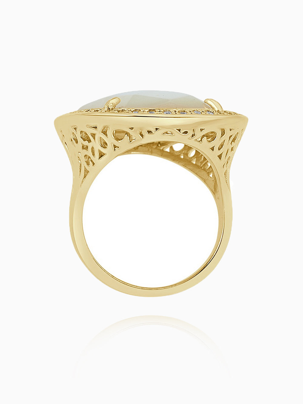 This statement ring features an elegant floral design, crafted from 14K gold-plated 925 sterling silver. The ring is adorned with 5A cubic zirconia and white mother of pearl, creating a striking and sophisticated look. Measuring 1.5 inches (3.8 cm) in length and 1 inch (2.5 cm) in width, this ring by Joy & Rachel is the perfect statement piece to add a touch of luxury to any outfit.