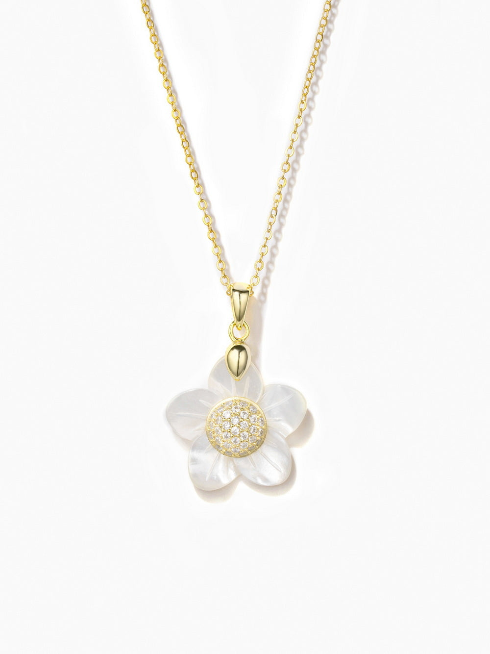 The necklace from Joy & Rachel is crafted from 14K gold plated over 925 sterling silver, featuring a delicate flower design. It is adorned with a 5A cubic zirconia stone and white mother of pearl for a sophisticated touch. The chain measures 16 inches, adjustable to 16", 17", and 18" (44 cm), and the pendant itself measures 0.8 inches. The necklace is finished with a secure lobster clasp.