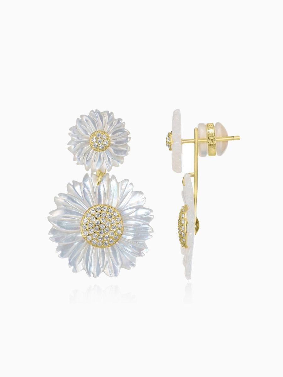 These stunning double daisy flower earrings are crafted from 14K gold-plated sterling silver and feature 5A cubic zirconia stones along with white mother of pearl. The earrings are designed with a post back for secure wear. Each earring measures 1.3 inches in length and 0.8 inches in width, and the piece is from the Joy & Rachel brand.