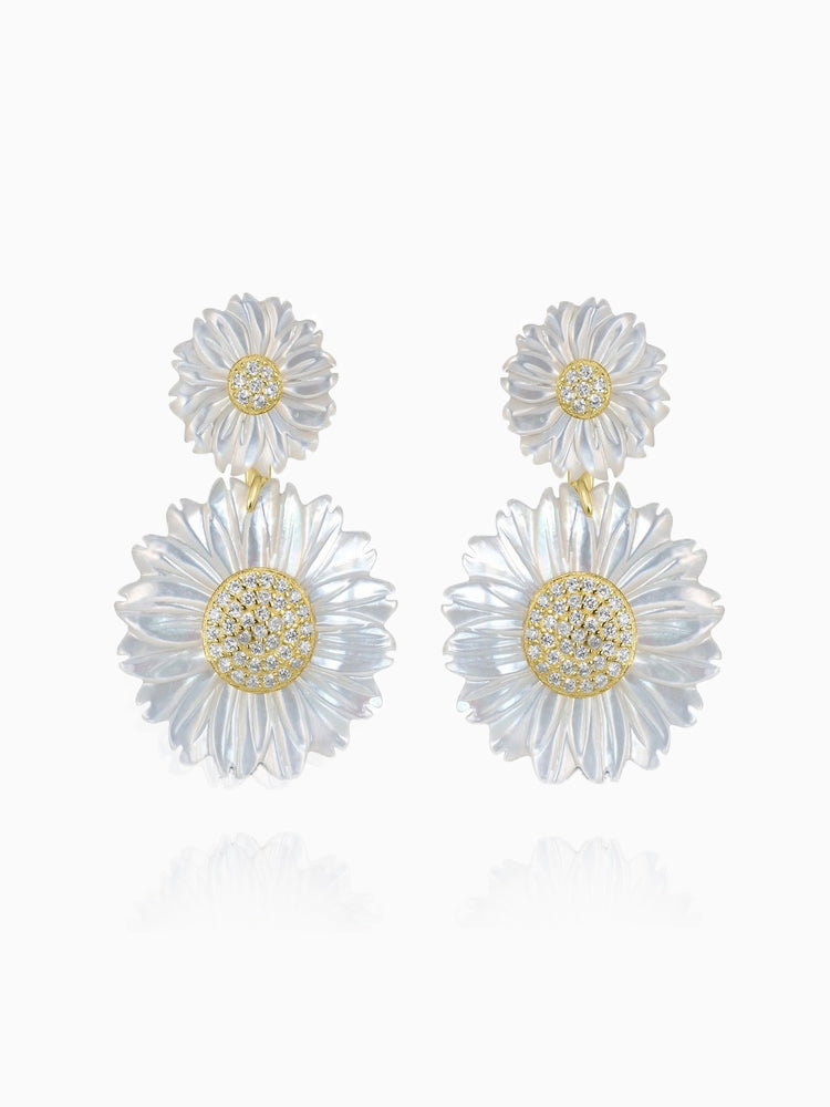 These stunning double daisy flower earrings are crafted from 14K gold-plated sterling silver and feature 5A cubic zirconia stones along with white mother of pearl. The earrings are designed with a post back for secure wear. Each earring measures 1.3 inches in length and 0.8 inches in width, and the piece is from the Joy & Rachel brand.